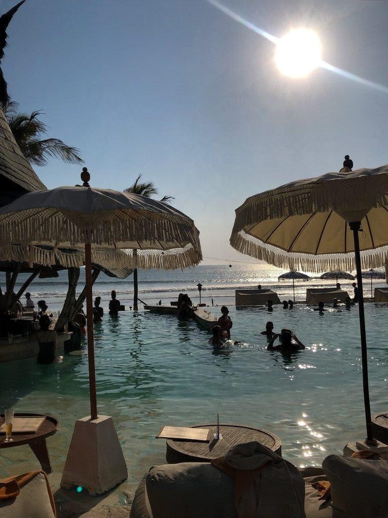 Umbrellas over a beach club pool