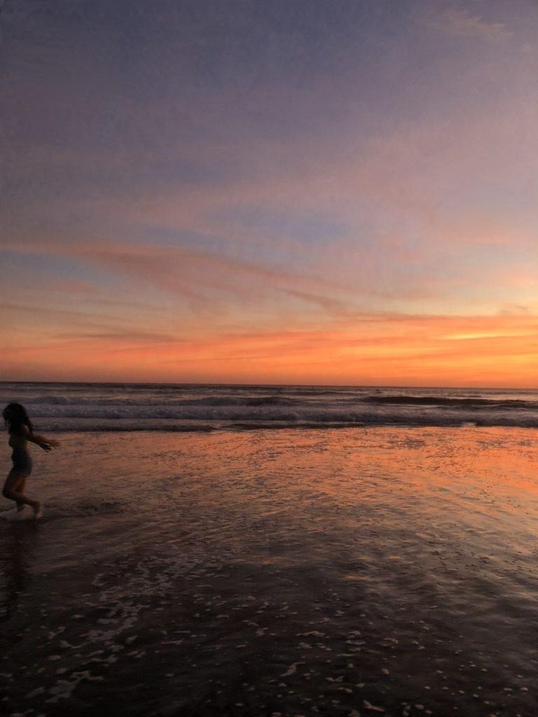 Sunset on a wet sand beach